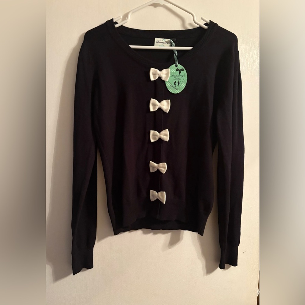 NWT Dancings Days By Banned Retro 70
Black Sweater with White Bows